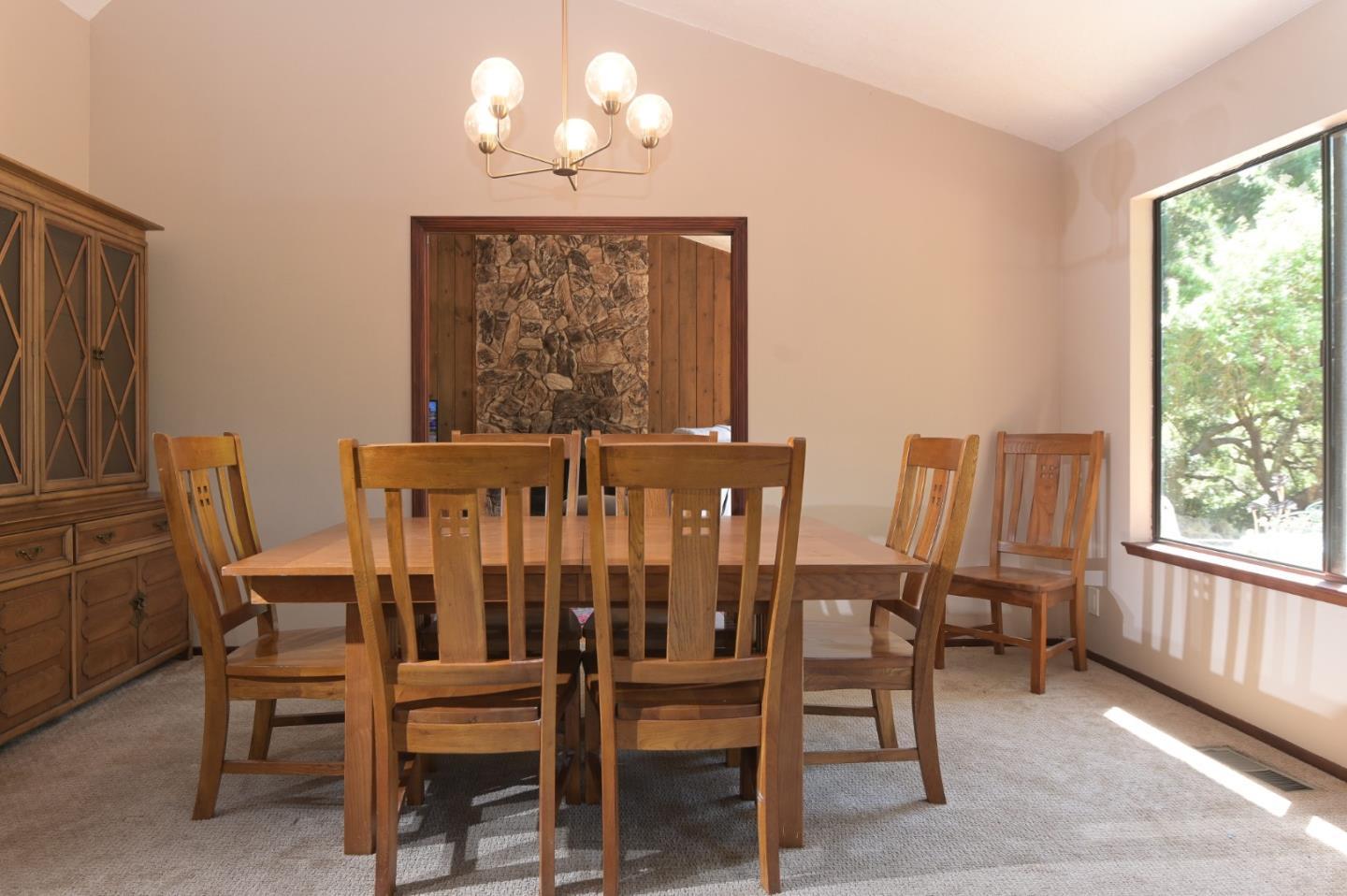 15223 Perry Lane Morgan Hill, CA 95037 - Photo 5 of 31 a view of a dining room with furniture wooden floor and chandelier
