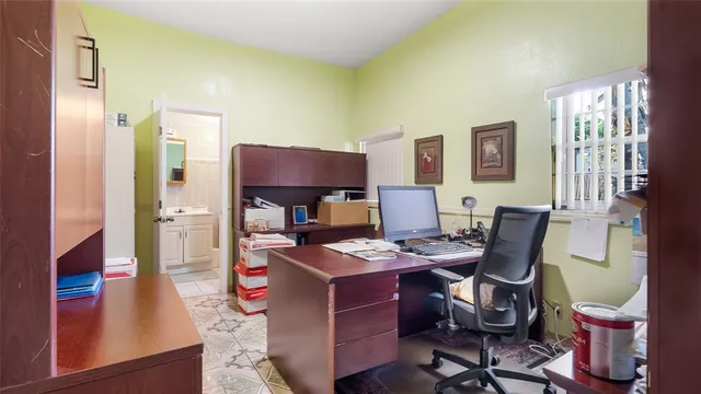 a workspace with furniture and window