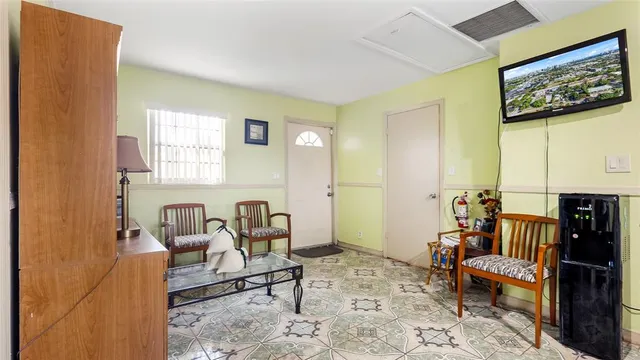 a living room with furniture and a rug