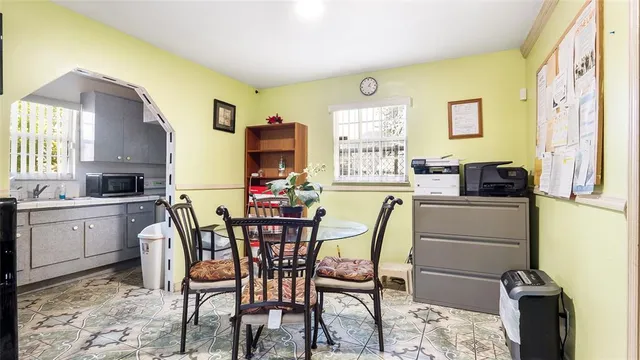 a dining room with furniture and window