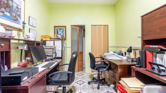 a view of a workspace with furniture