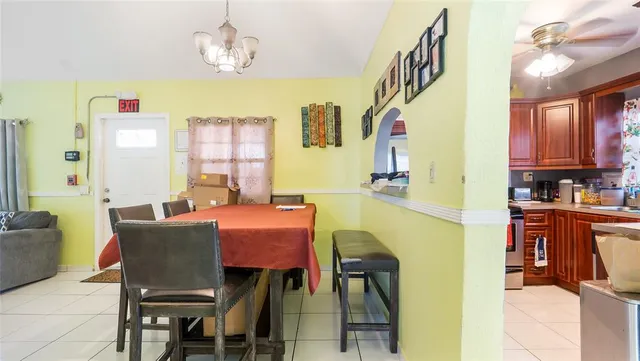 a dining room with furniture and window