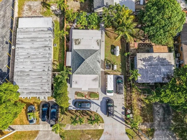 an aerial view of residential houses with outdoor space