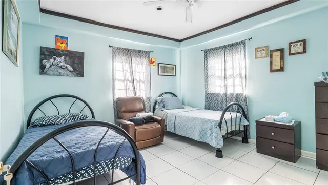 a bedroom with furniture a bed and a window