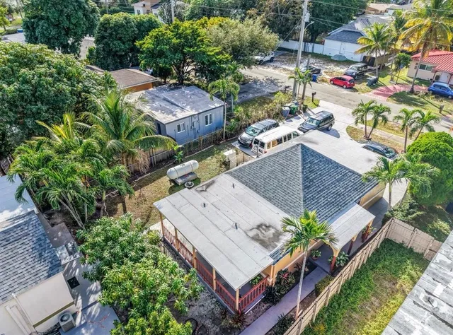 an aerial view of a house with a garden
