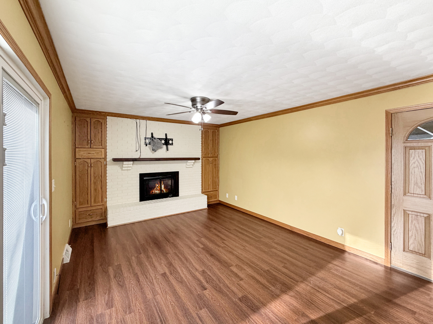 1419 Finch Street Freeport, IL 61032 - Photo 15 of 30 a view of an empty room with a fireplace and a window