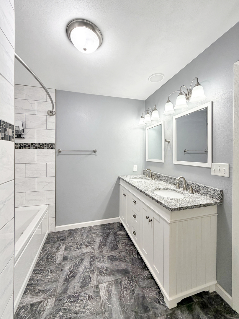 1419 Finch Street Freeport, IL 61032 - Photo 20 of 30 a bathroom with a sink and a mirror