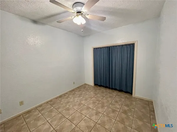 an empty room with fan