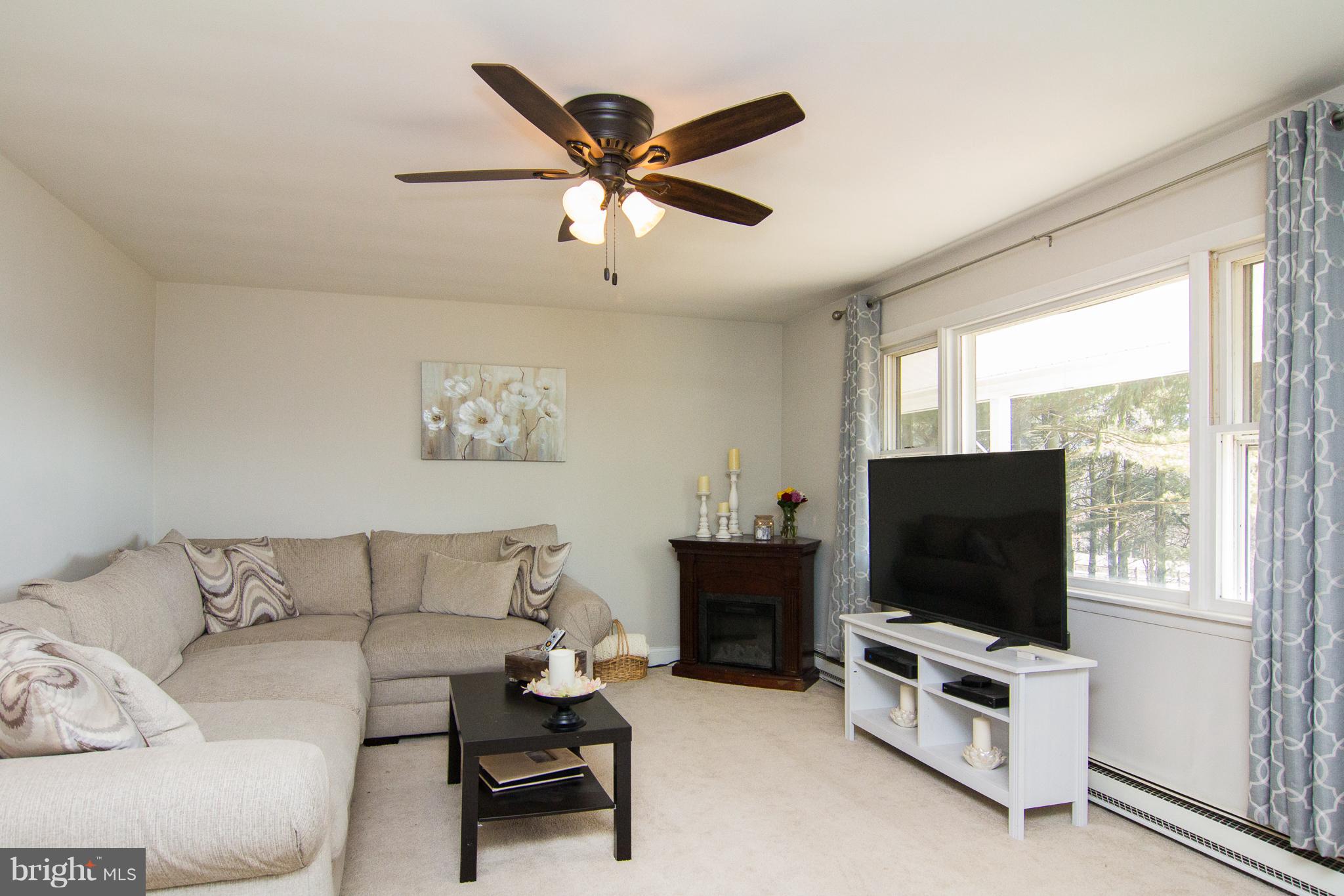 4394 Utz Road Hampstead, MD 21074 - Photo 3 of 30 a living room with furniture and a flat screen tv