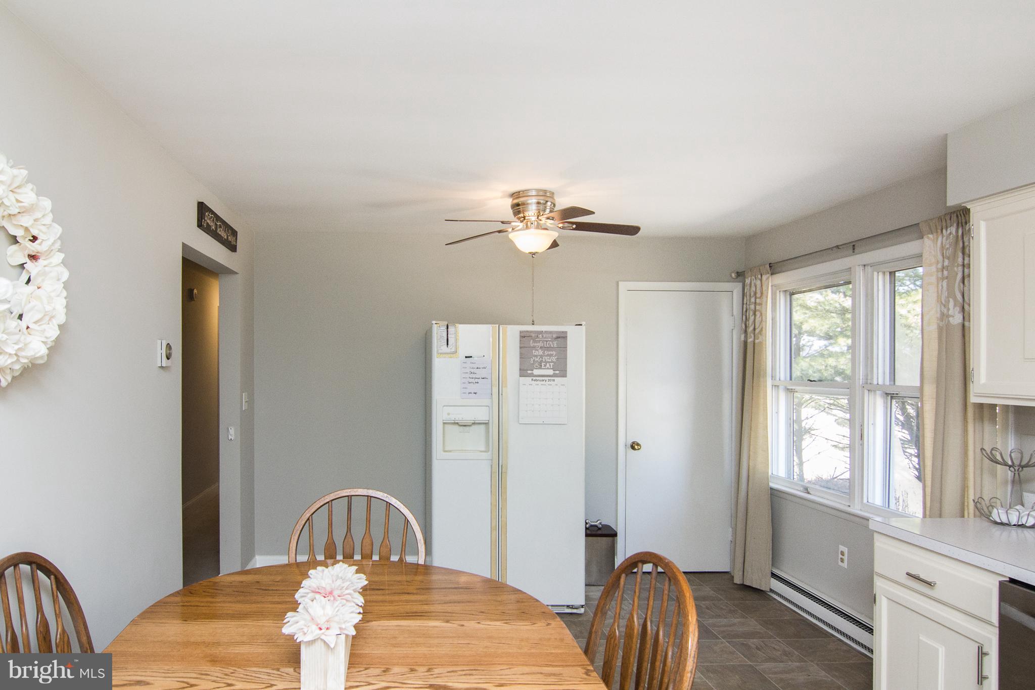 4394 Utz Road Hampstead, MD 21074 - Photo 8 of 30 a bedroom with a bed and a chandelier