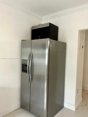 a close view of a refrigerator in kitchen and a refrigerator