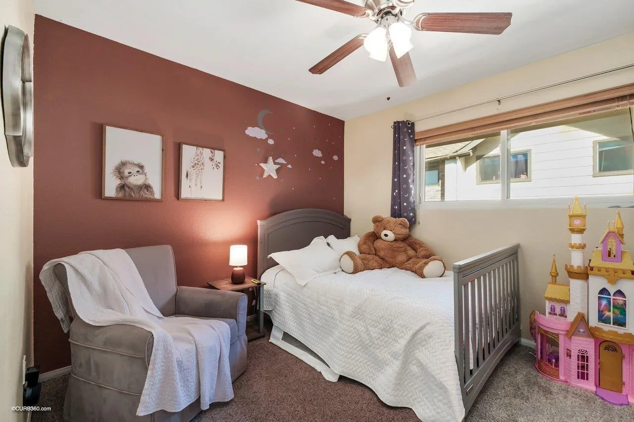 2648 Alpine Boulevard, Unit B Alpine, CA 91901 - Photo 12 of 25 a bedroom with a bed and a chandelier