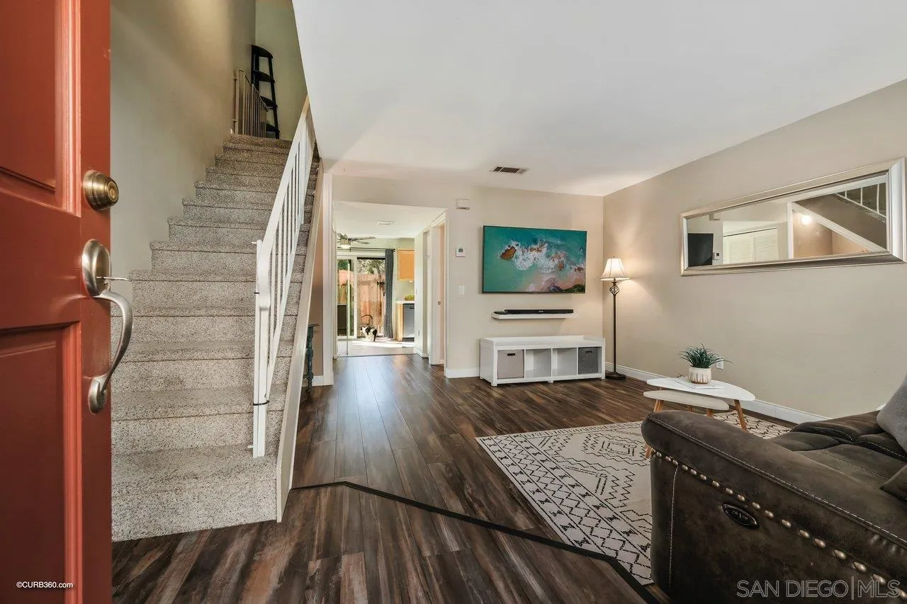 2648 Alpine Boulevard, Unit B Alpine, CA 91901 - Photo 2 of 25 a living room with furniture and a flat screen tv