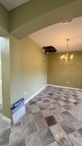 a view of a room with a refrigerator