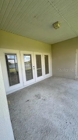 a view of an empty room with windows
