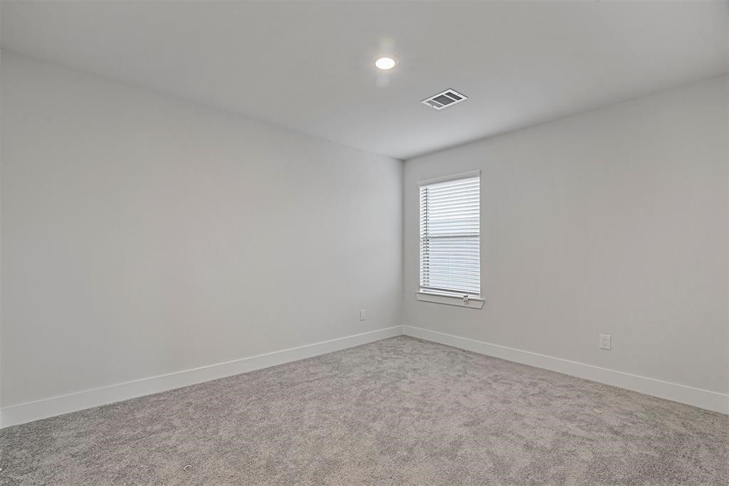 10638 Whitejacket Conroe, TX 77385 - Photo 2 of 25 an empty room with windows and closet