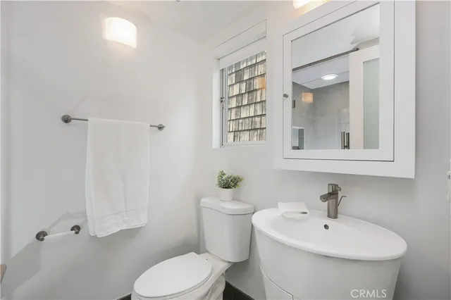 a large kitchen with stainless steel appliances kitchen island granite countertop a large counter top and a stove top oven