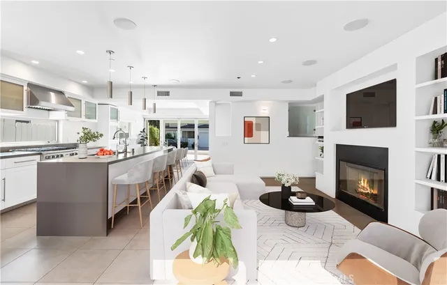 a large white bathroom with a large tub sink and vanity