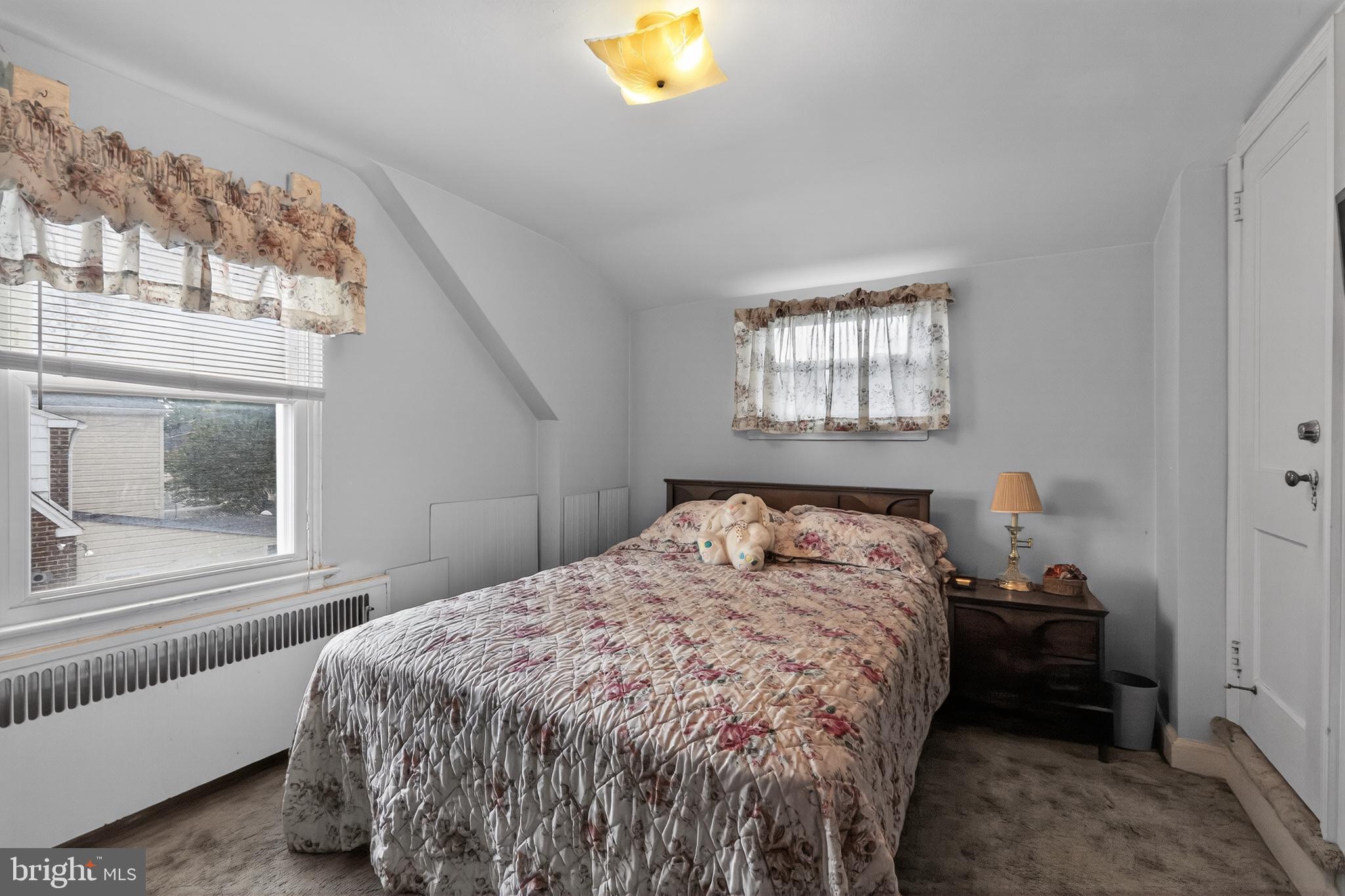 1424 Burmont Road Havertown, PA 19083 - Photo 29 of 37 a bedroom with a bed and a window