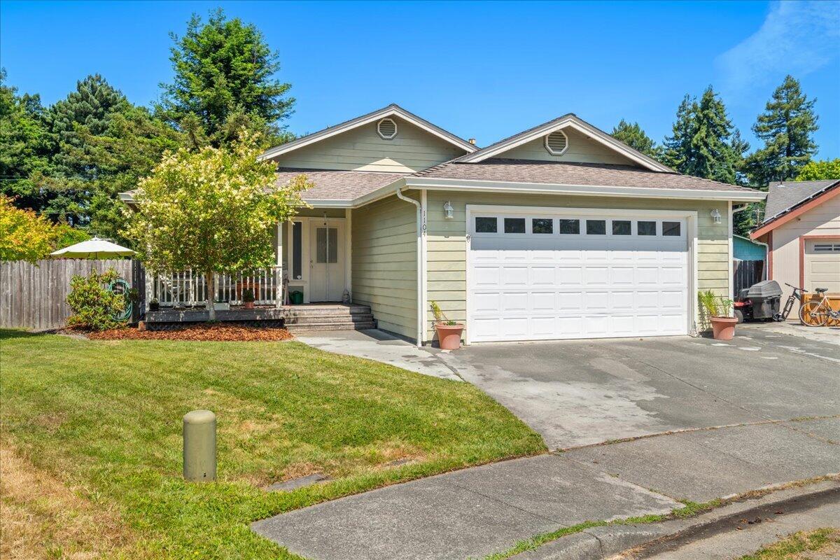 1104 Tyme Court Rio Dell, CA 95562 - Photo 1 of 1 a front view of a house with a yard and garage