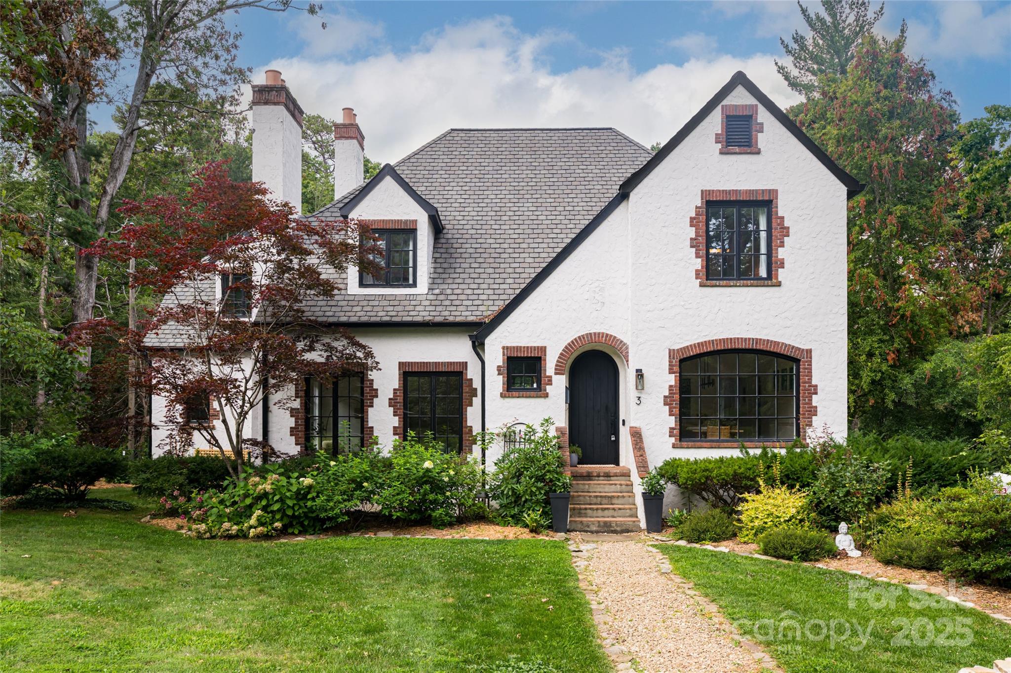 3 Lone Pine Road Biltmore Forest, NC 28803 - Photo 1 of 47 a front view of a house with a yard