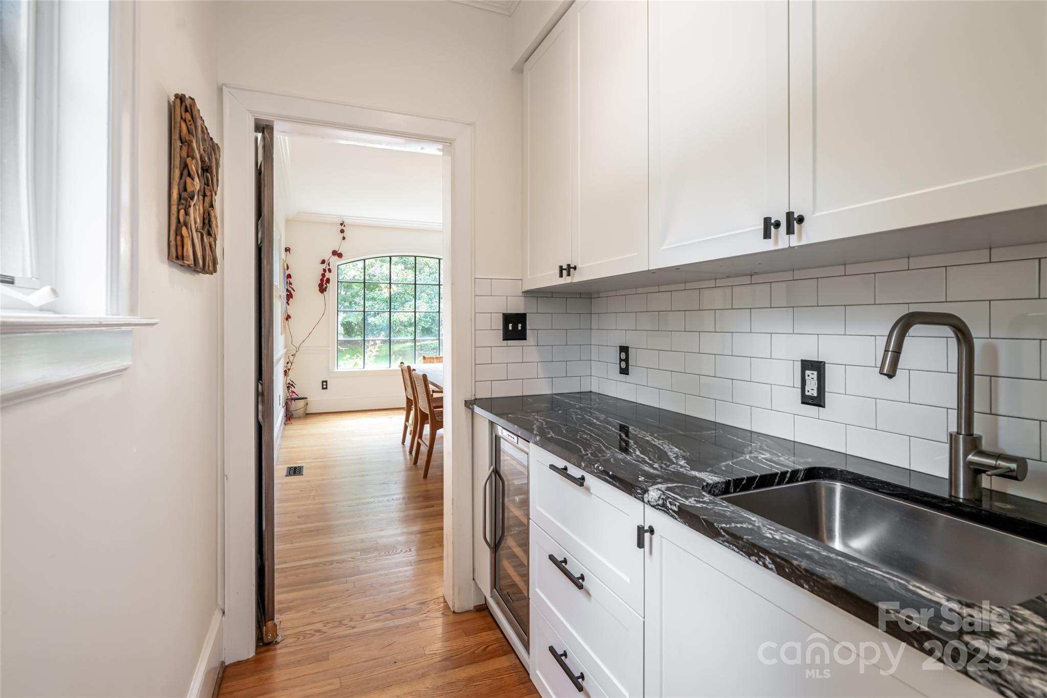 3 Lone Pine Road Biltmore Forest, NC 28803 - Photo 12 of 47 a kitchen with granite countertop a sink and cabinets