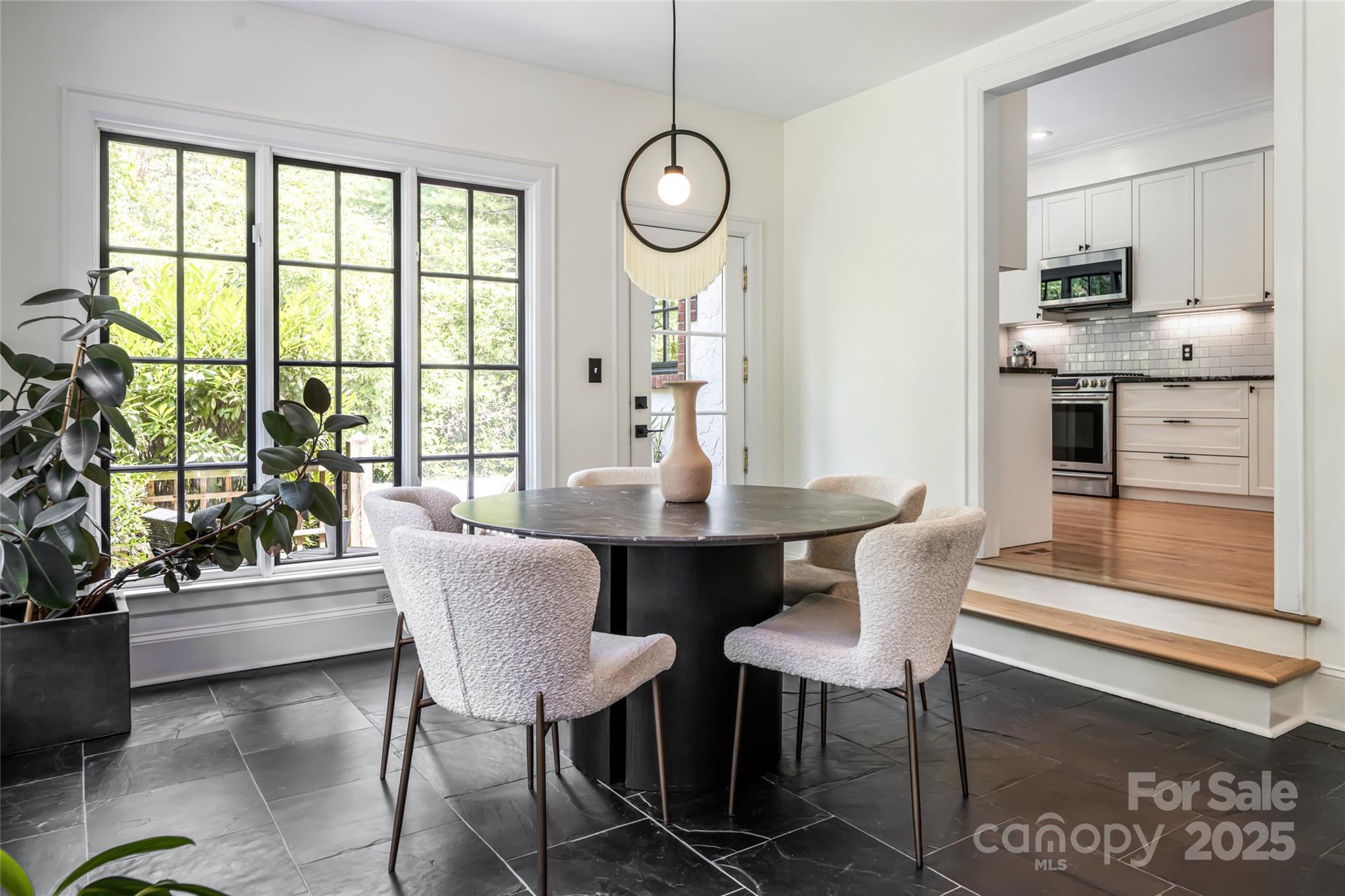 3 Lone Pine Road Biltmore Forest, NC 28803 - Photo 13 of 47 a dining room with furniture a chandelier and wooden floor