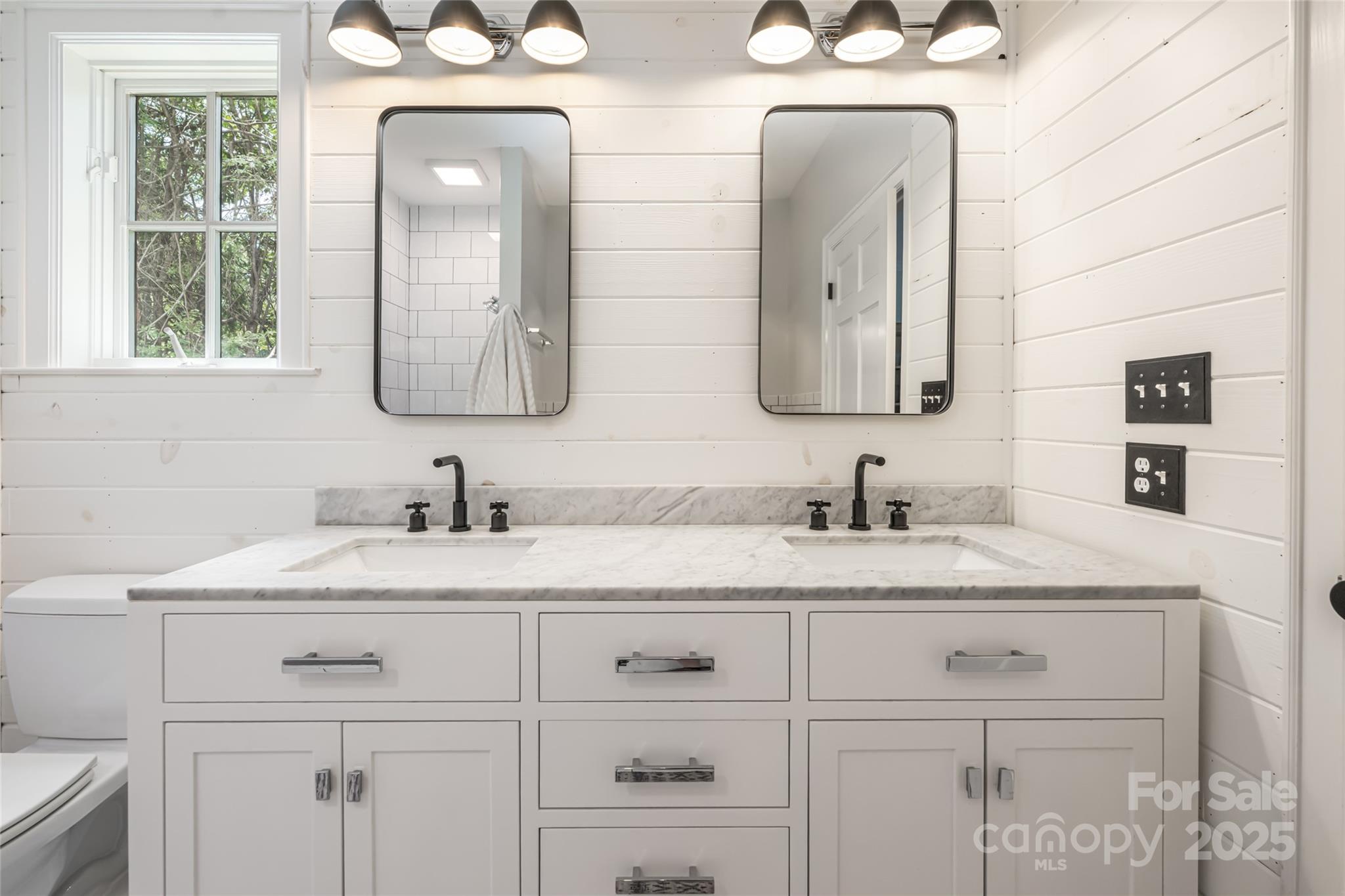 3 Lone Pine Road Biltmore Forest, NC 28803 - Photo 18 of 47 a bathroom with double sink and a mirror
