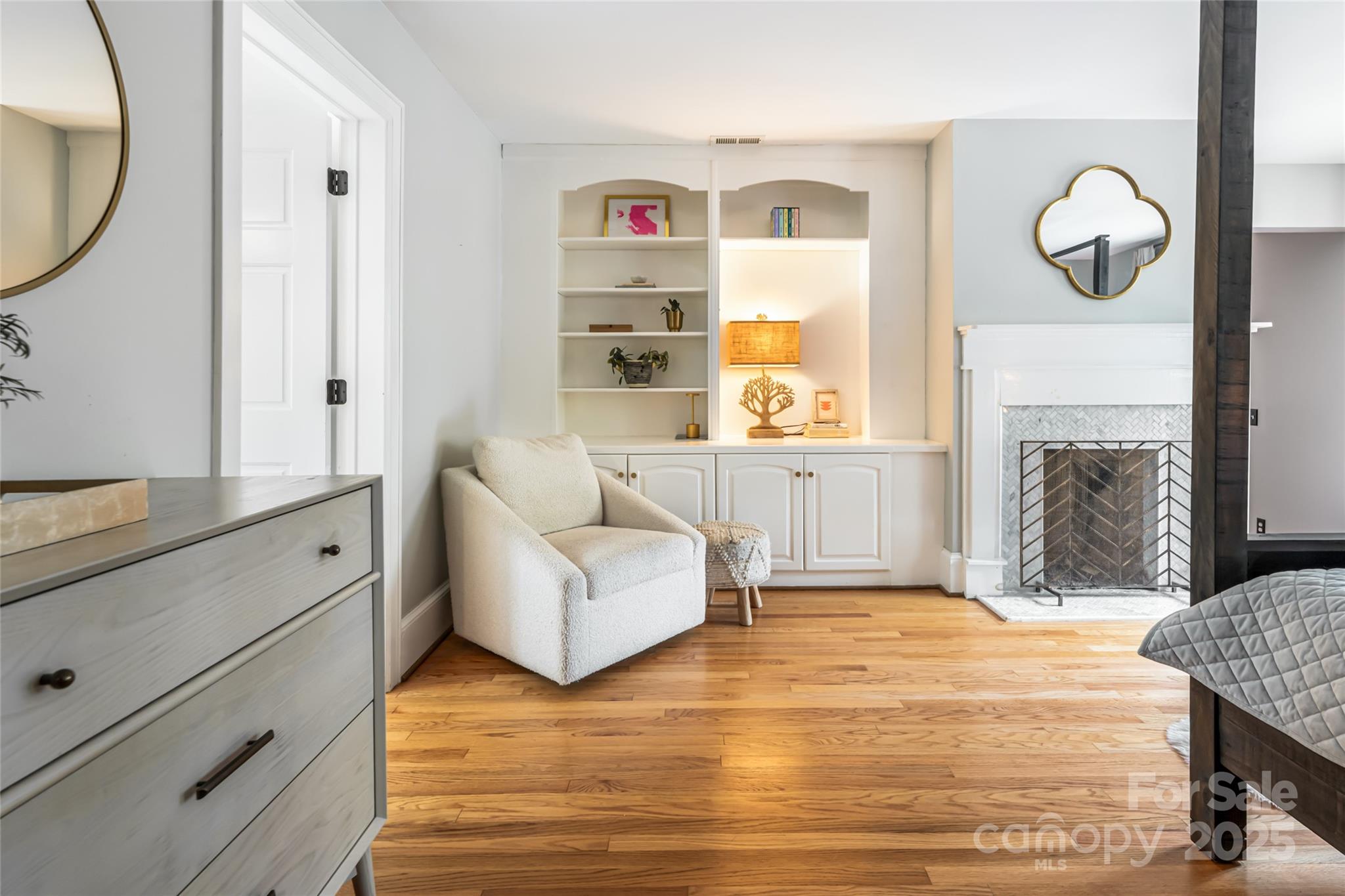 3 Lone Pine Road Biltmore Forest, NC 28803 - Photo 21 of 47 a living room with furniture a fireplace and a large window