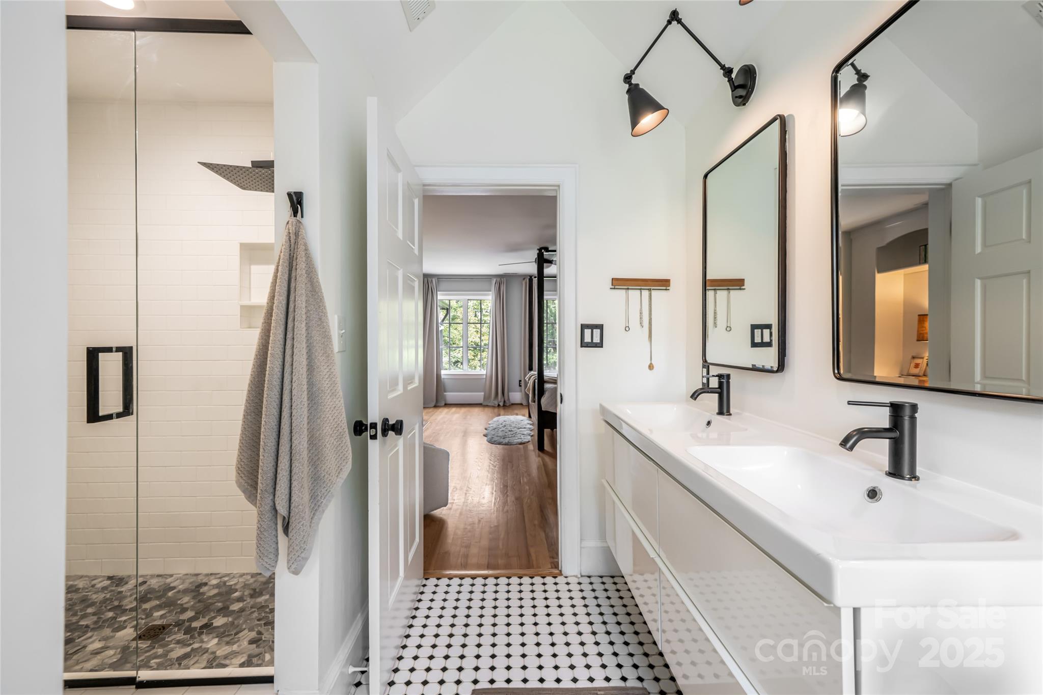 3 Lone Pine Road Biltmore Forest, NC 28803 - Photo 22 of 47 a bathroom with a double vanity sink a mirror and shower
