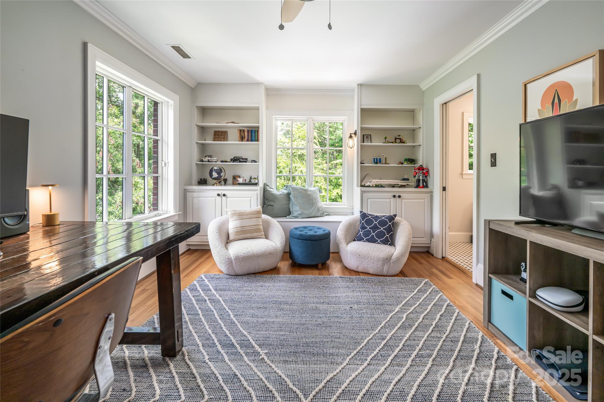 3 Lone Pine Road Biltmore Forest, NC 28803 - Photo 24 of 47 a large living room with stainless steel appliances furniture a large window and a wooden floor