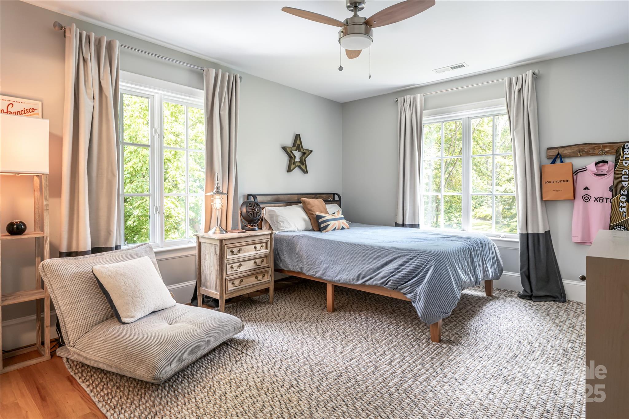 3 Lone Pine Road Biltmore Forest, NC 28803 - Photo 25 of 47 a bedroom with a large bed and a couch