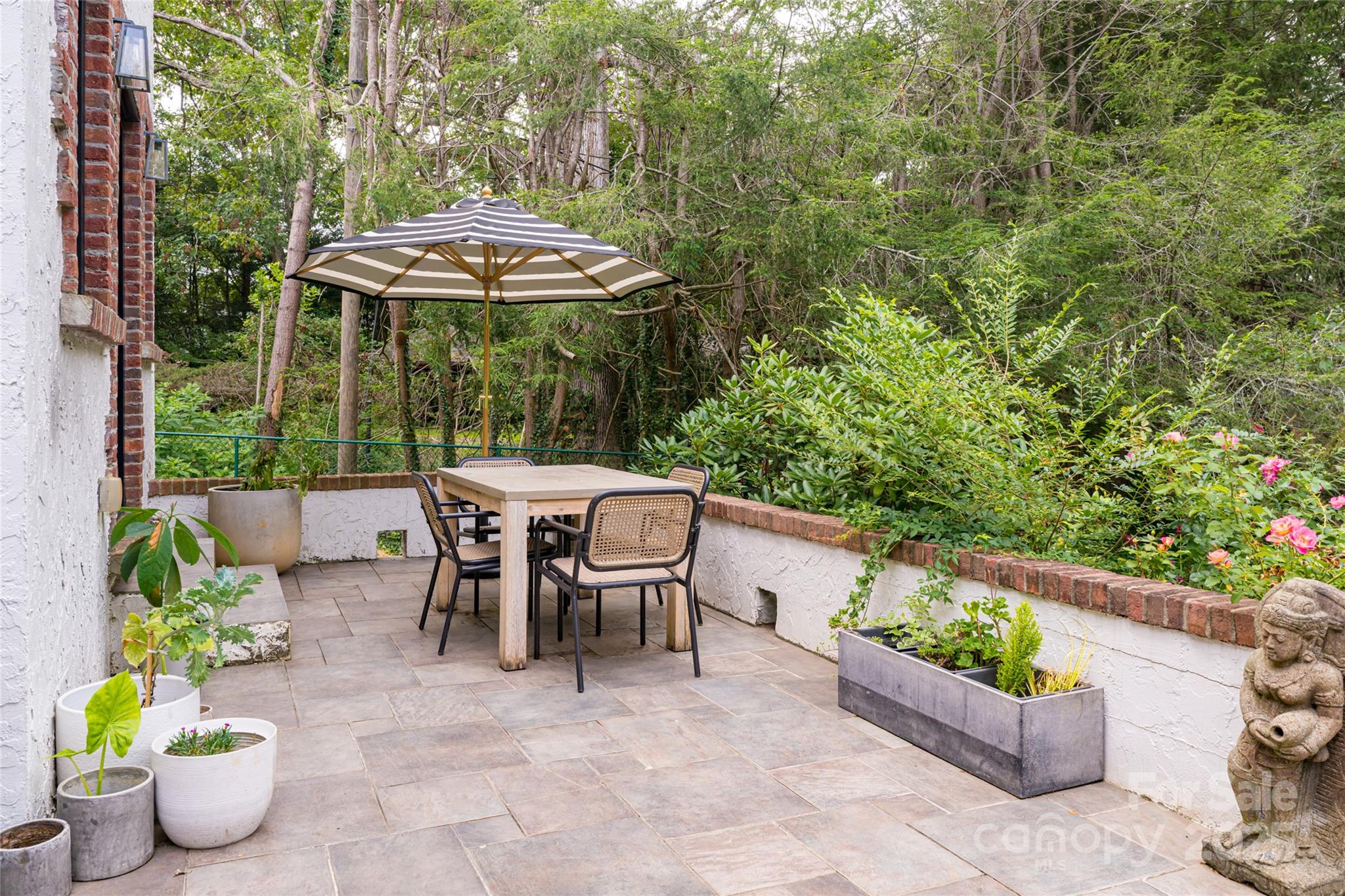 3 Lone Pine Road Biltmore Forest, NC 28803 - Photo 28 of 47 a view of a table and chairs in patio with potted plants