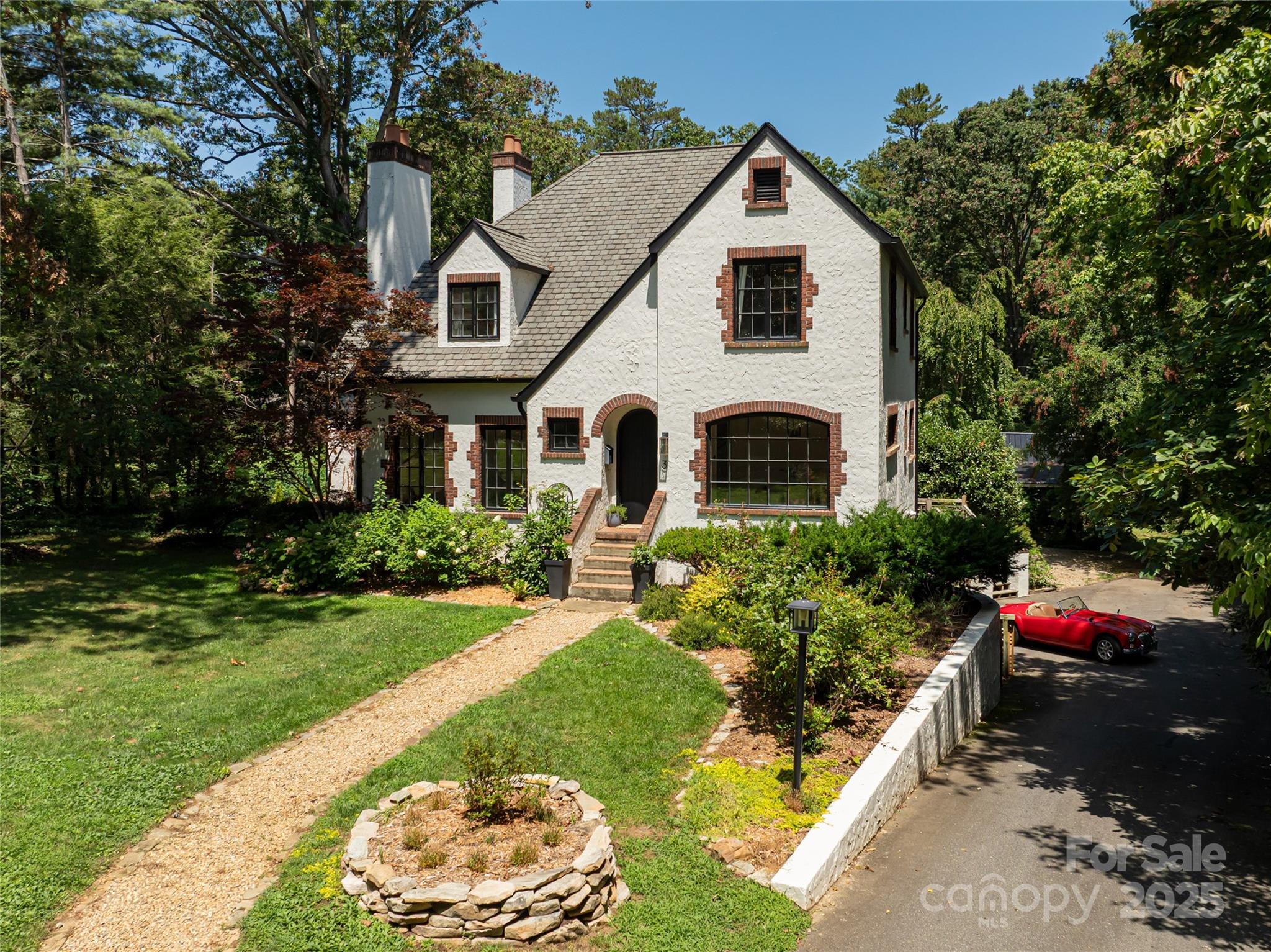 3 Lone Pine Road Biltmore Forest, NC 28803 - Photo 3 of 47 a front view of a house with a yard