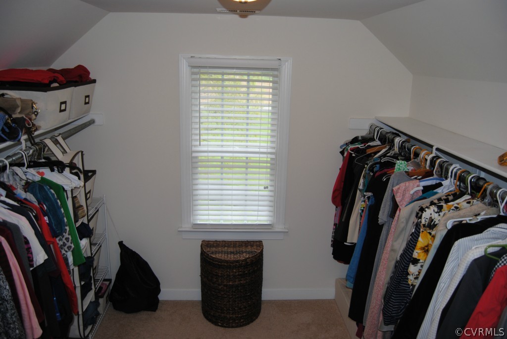 472 Three Chopt Road Manakin-Sabot, VA 23103 - Photo 14 of 23 a view of walk in closet with clothes and shoes