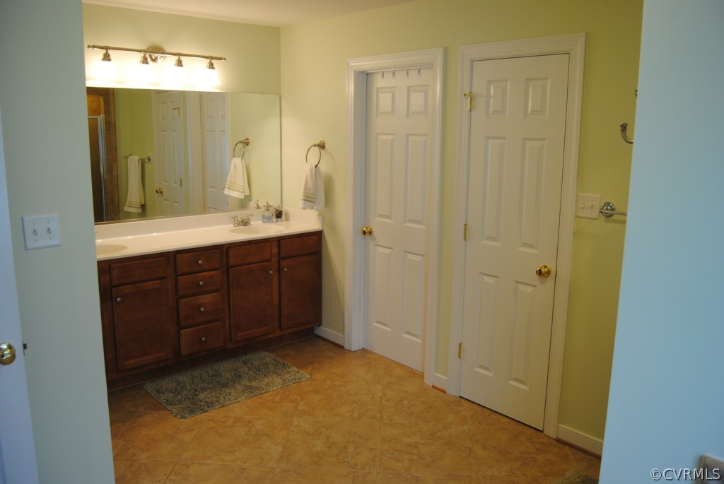 472 Three Chopt Road Manakin-Sabot, VA 23103 - Photo 15 of 23 a bathroom with a sink and a mirror