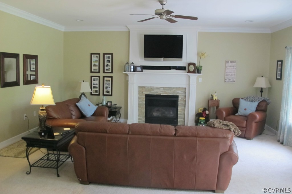 472 Three Chopt Road Manakin-Sabot, VA 23103 - Photo 3 of 23 a living room with furniture a flat screen tv and a fireplace