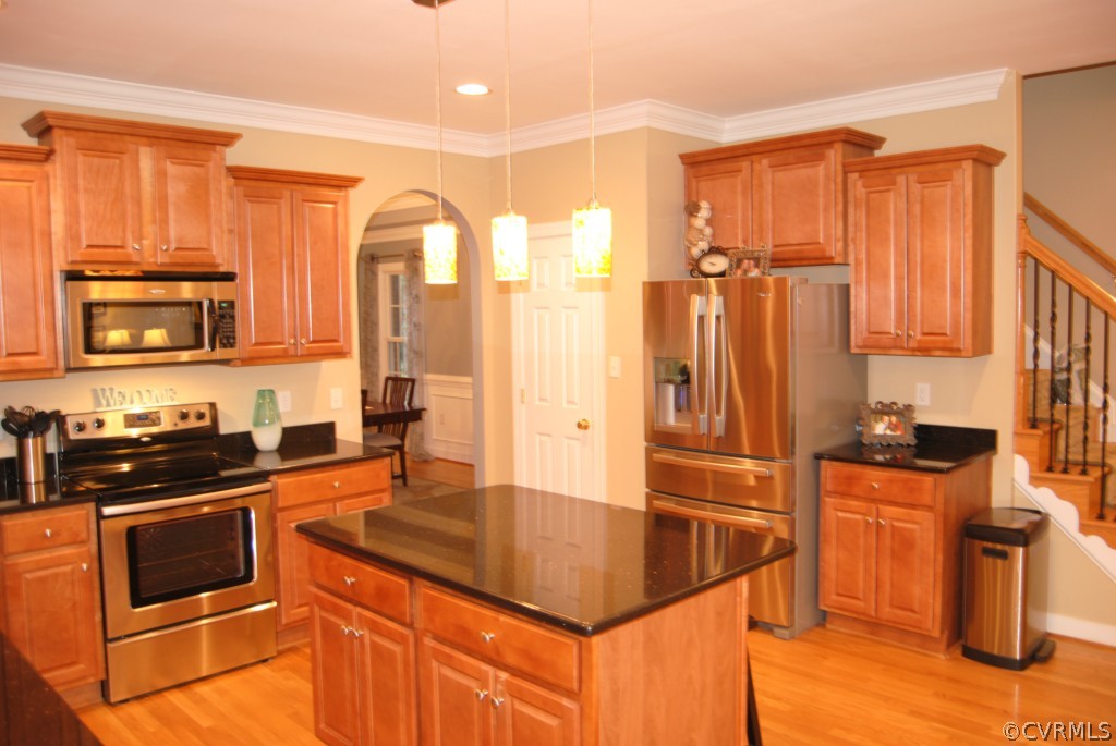 472 Three Chopt Road Manakin-Sabot, VA 23103 - Photo 4 of 23 a kitchen with stainless steel appliances granite countertop a stove a sink and a refrigerator