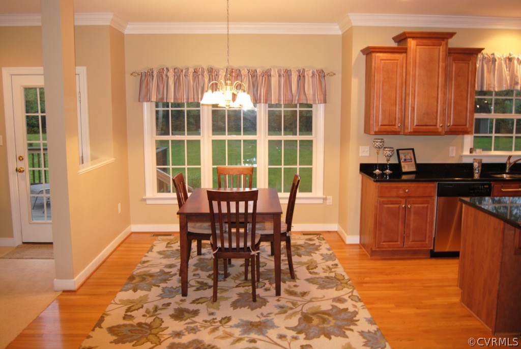 472 Three Chopt Road Manakin-Sabot, VA 23103 - Photo 6 of 23 a dining room with furniture and wooden floor