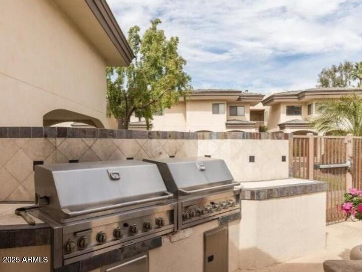 3235 East Camelback Road, Unit 104 Phoenix, AZ 85018 - Photo 15 of 17 an aerial view of a house with a yard