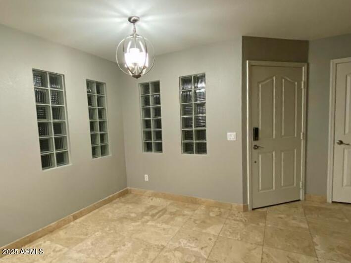 3235 East Camelback Road, Unit 104 Phoenix, AZ 85018 - Photo 4 of 17 a view of an empty room with a window