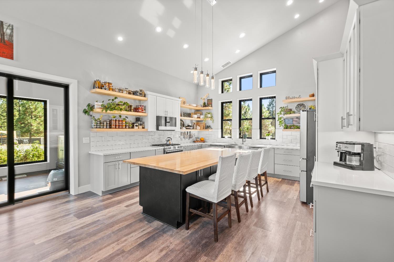 29115 Secret Town Road Colfax, CA 95713 - Photo 2 of 82 a dining hall with stainless steel appliances granite countertop a refrigerator a sink dishwasher a dining table and chairs with wooden floor