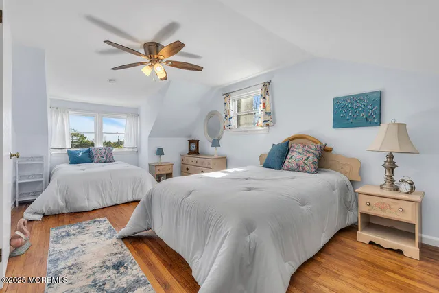a bedroom with bed and a chandelier