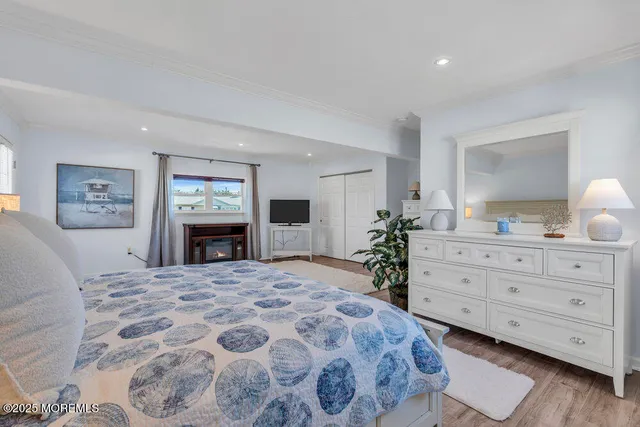 a bedroom with a large bed and a dresser