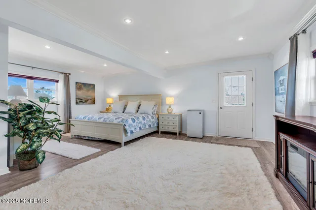 a balcony with a table and chairs under an umbrella