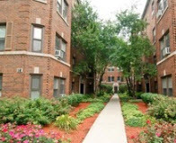 56 Forest Avenue, Unit 3N Riverside, IL 60546 - Photo 1 of 10 a front view of a multi story building with yard