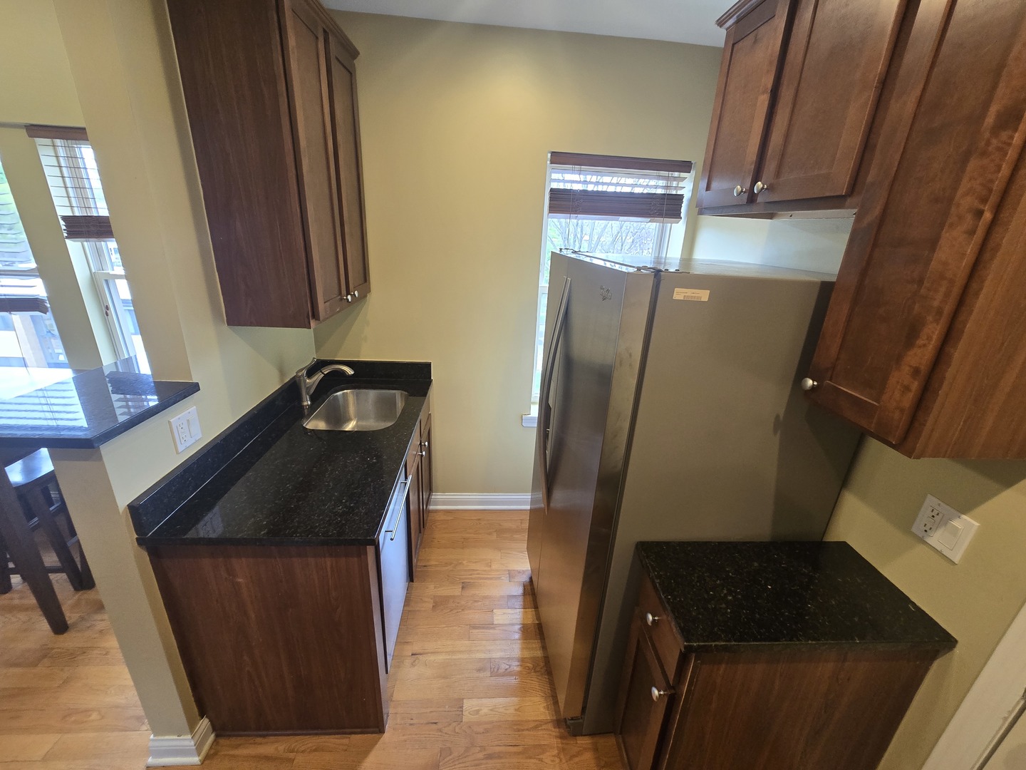 56 Forest Avenue, Unit 3N Riverside, IL 60546 - Photo 3 of 10 a bathroom with a granite countertop sink and a mirror