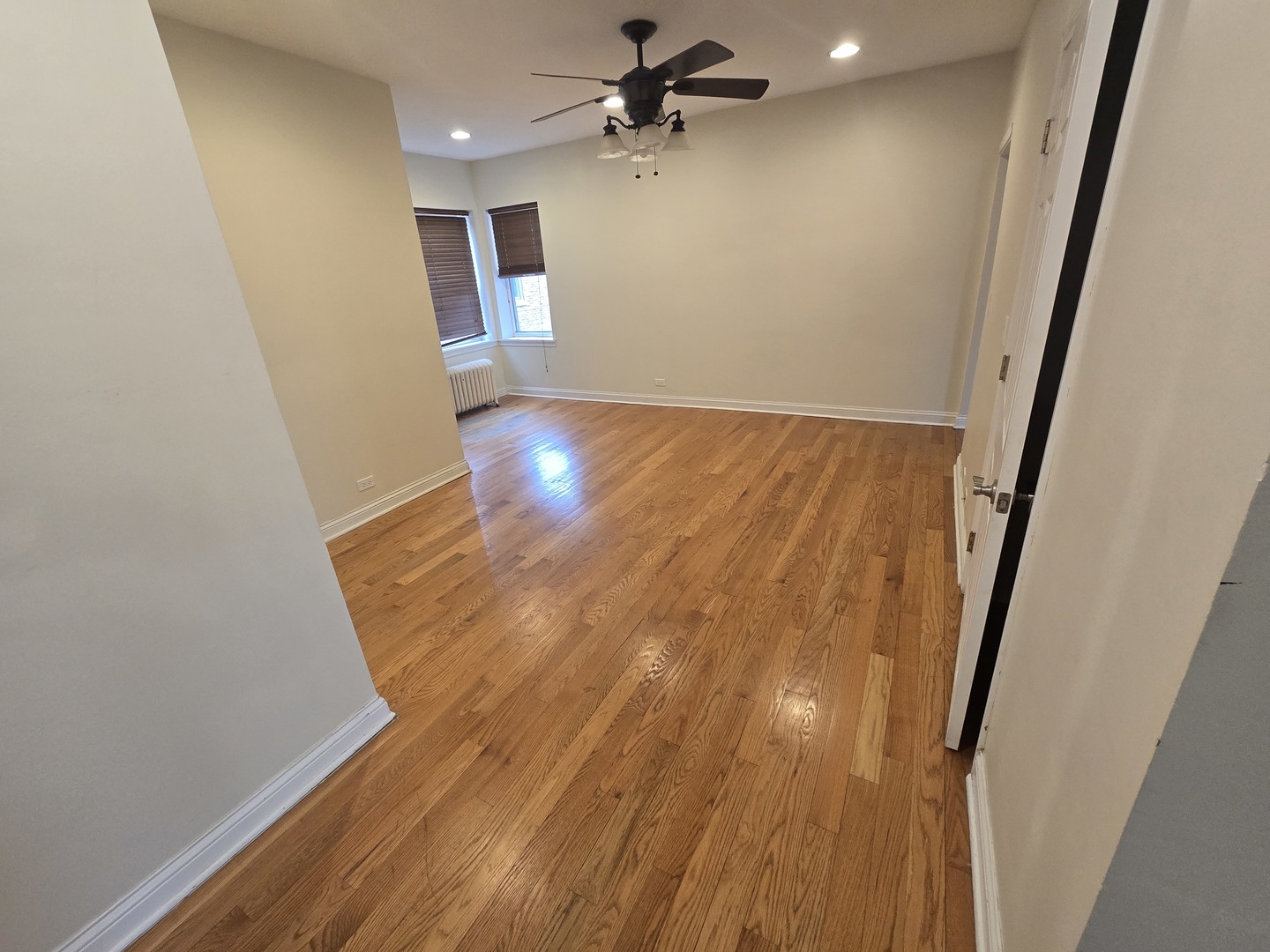 56 Forest Avenue, Unit 3N Riverside, IL 60546 - Photo 8 of 10 wooden floor in an empty room with a window