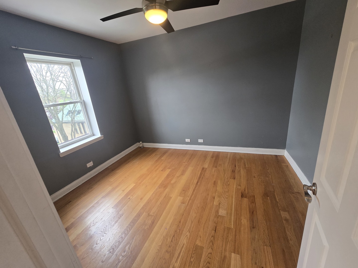 56 Forest Avenue, Unit 3N Riverside, IL 60546 - Photo 10 of 10 an empty room with wooden floor and windows