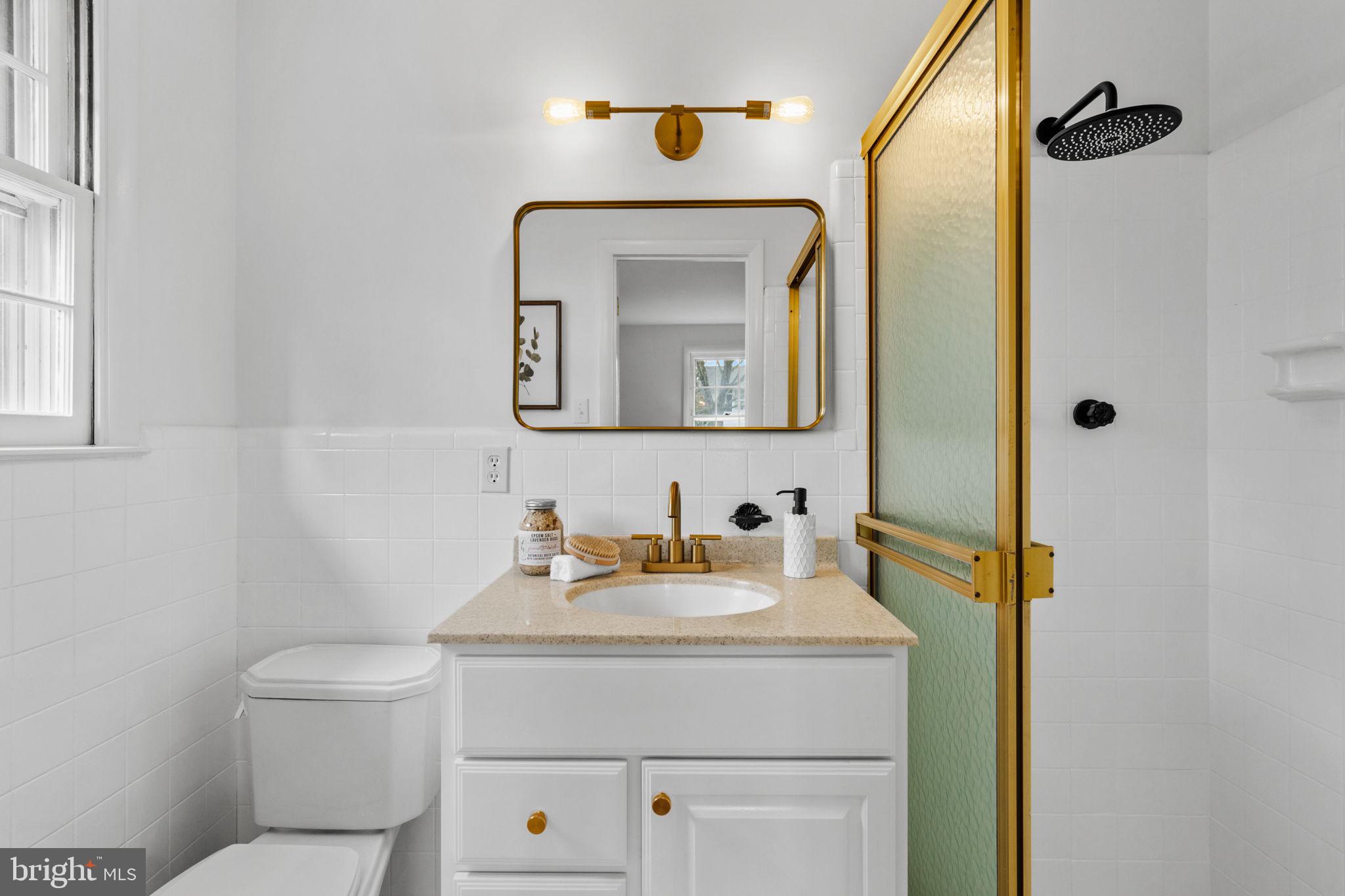 2529 Raven Road Wilmington, DE 19810 - Photo 23 of 80 a bathroom with a toilet sink and mirror